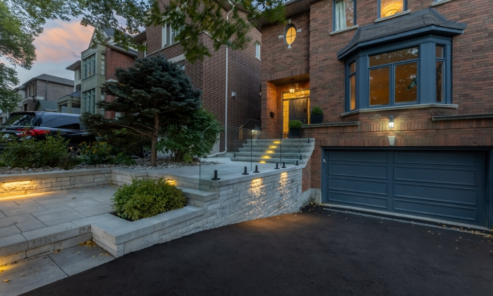 custom retaining wall with railings glass lighting