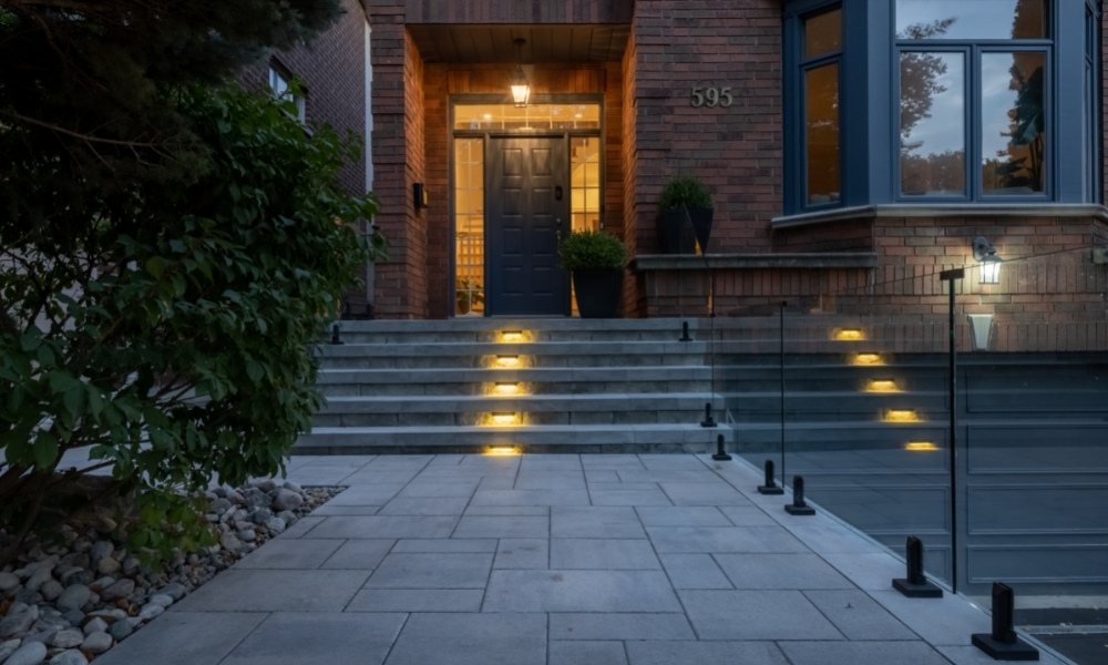 custom retaining wall with railings lighting glass